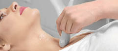 Young woman undergoing ultrasound scan in modern clinic